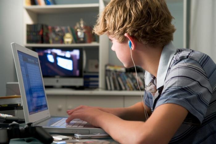 White boy 2 on laptop looking at computer pic.jpg